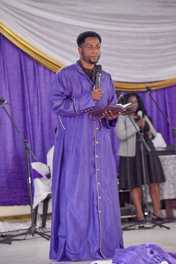 Prophet preaching at the altar
